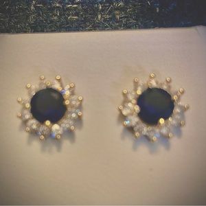 Genuine Natural blue sapphire earrings surrounded in cubic zirconia.